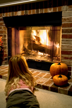 Child and fireplace